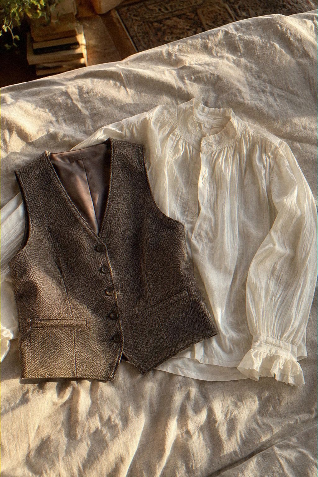Pair a Tailored Vest With a Feminine Blouse