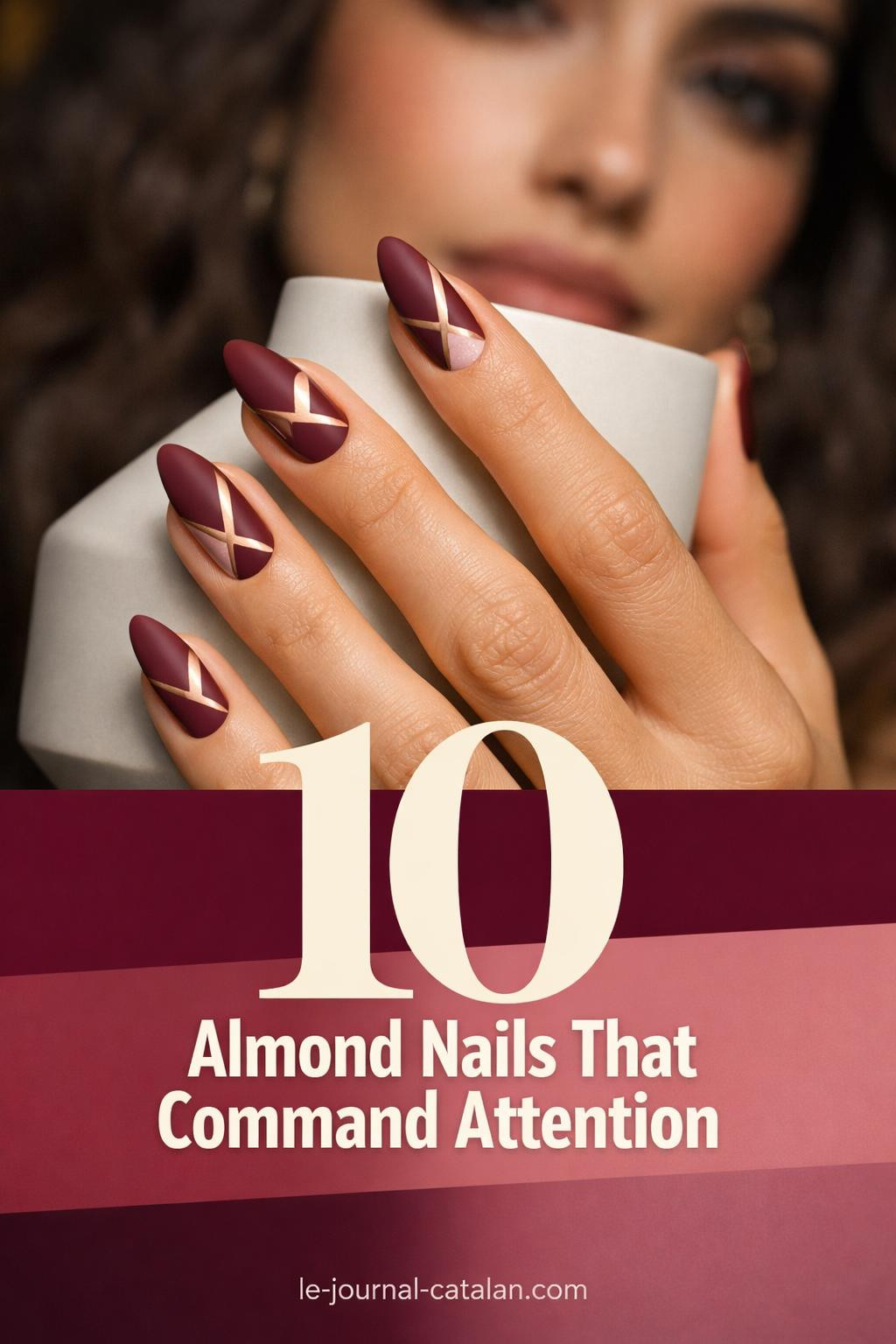 Single hero photograph showcasing wine burgundy almond nails with geometric negative space and rose gold accents