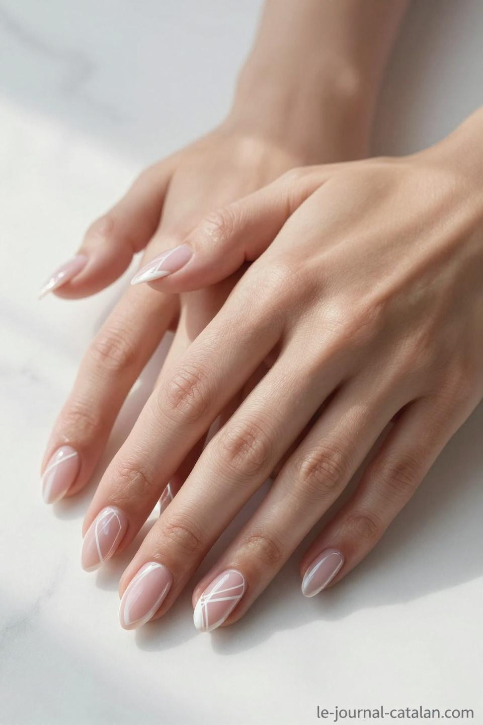 Elegant Almond Nails featuring geometric negative space with rose gold