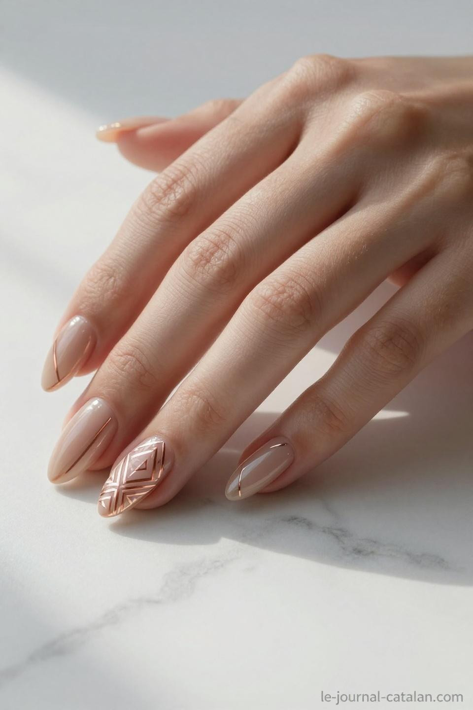 Trendy Almond Nails with precise angular gold geometric design
