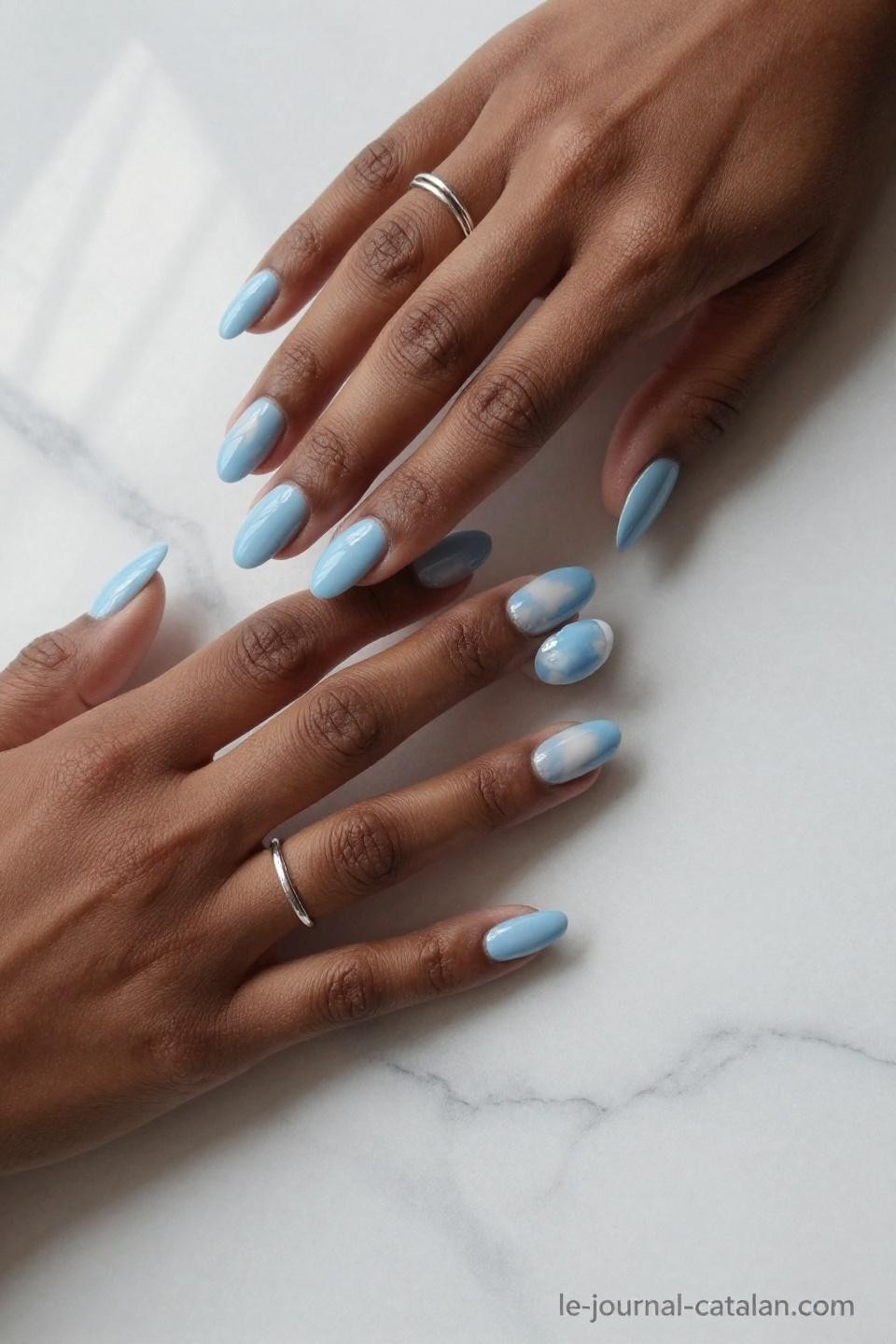 Royal blue nails featuring baby blue with white French tip accents on almond nails