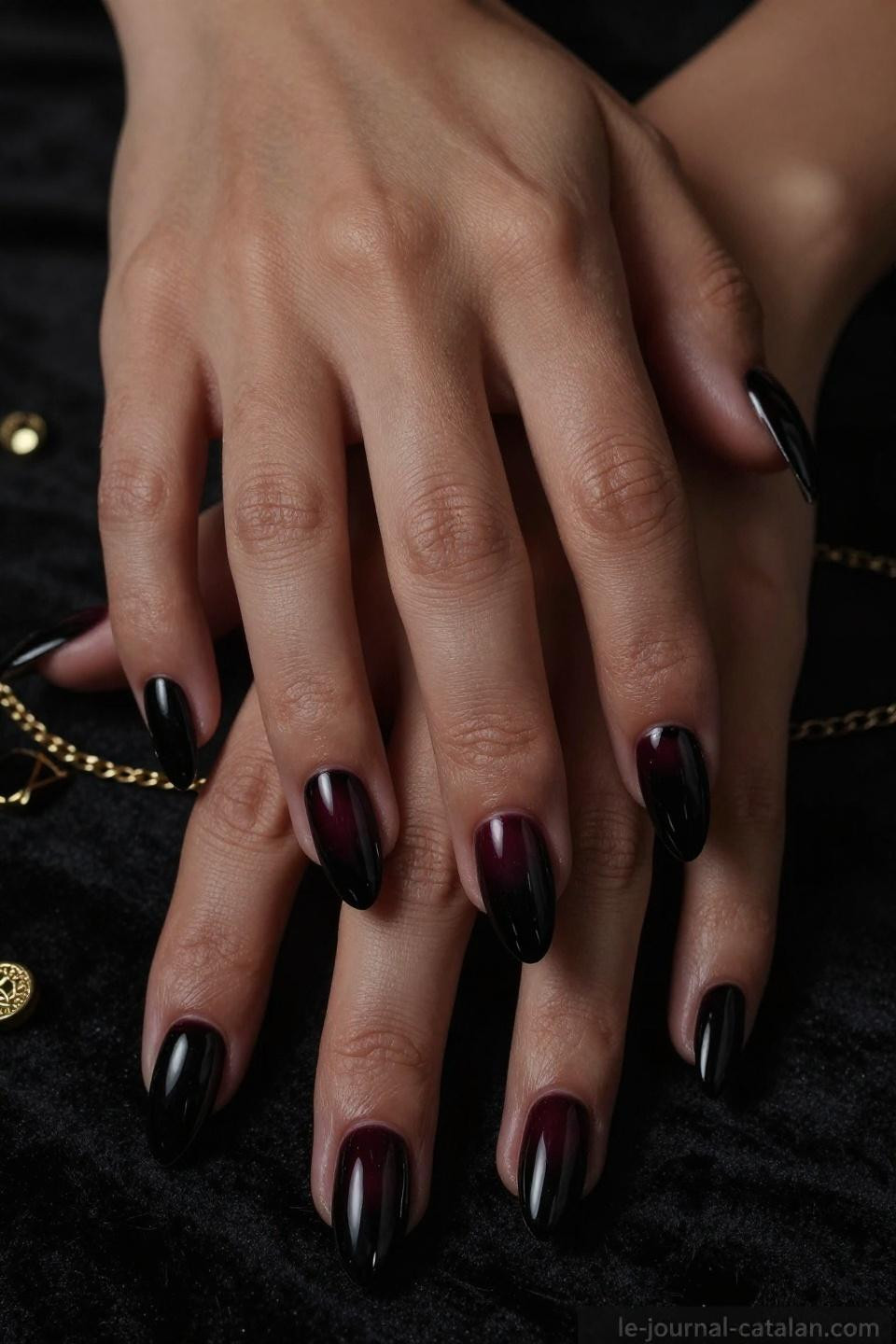 dark nail designs with glossy black almond shape on deep mahogany skin