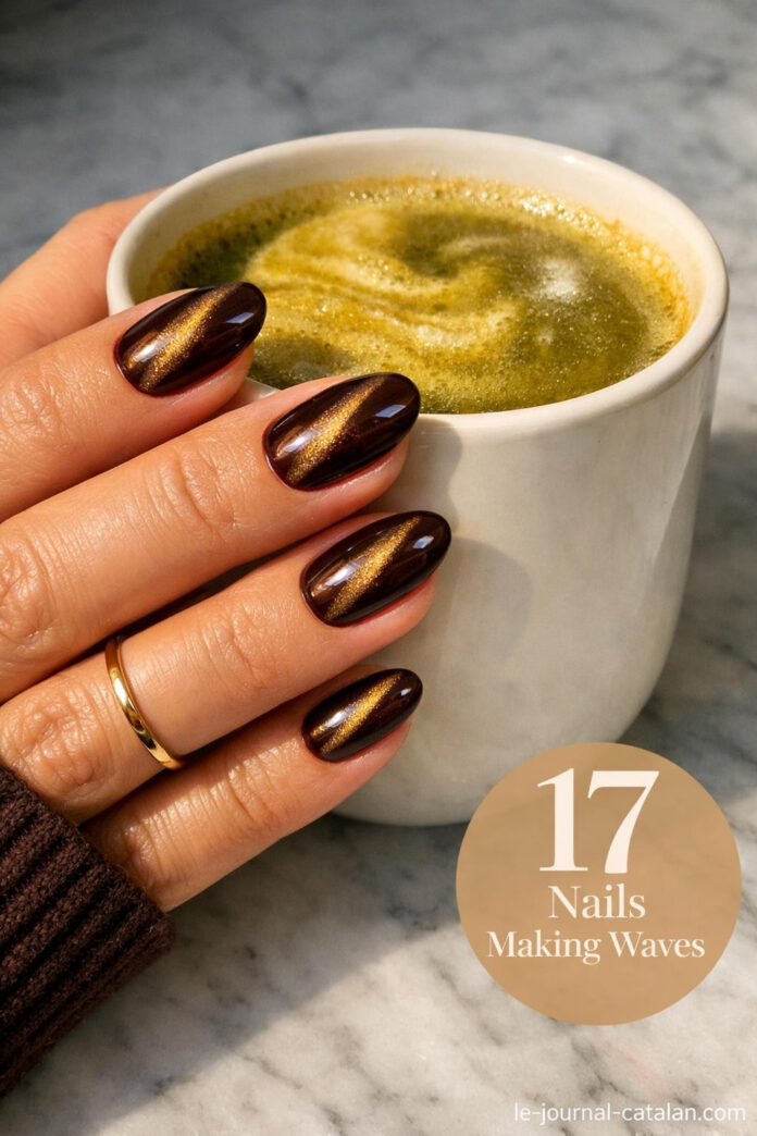 Fall cateye nails in rich brown chrome with sleek cat eye effect, featuring neutral coffee-toned nail design for autumn manicure inspiration