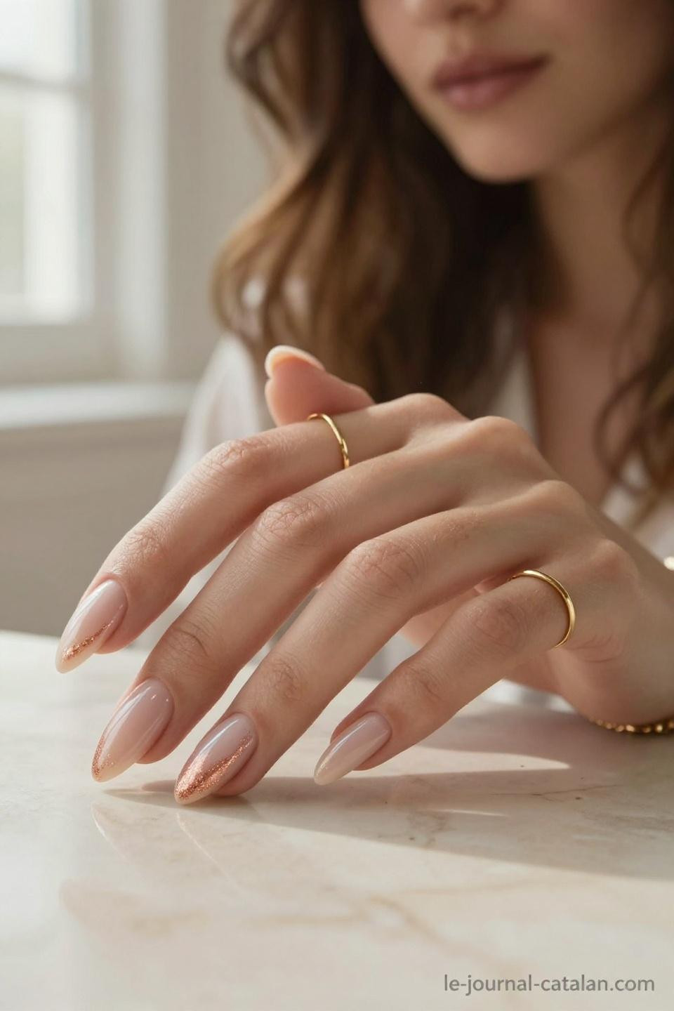 Pretty Almond Nails Classy soft nude with rose gold shimmer on porcelain hands