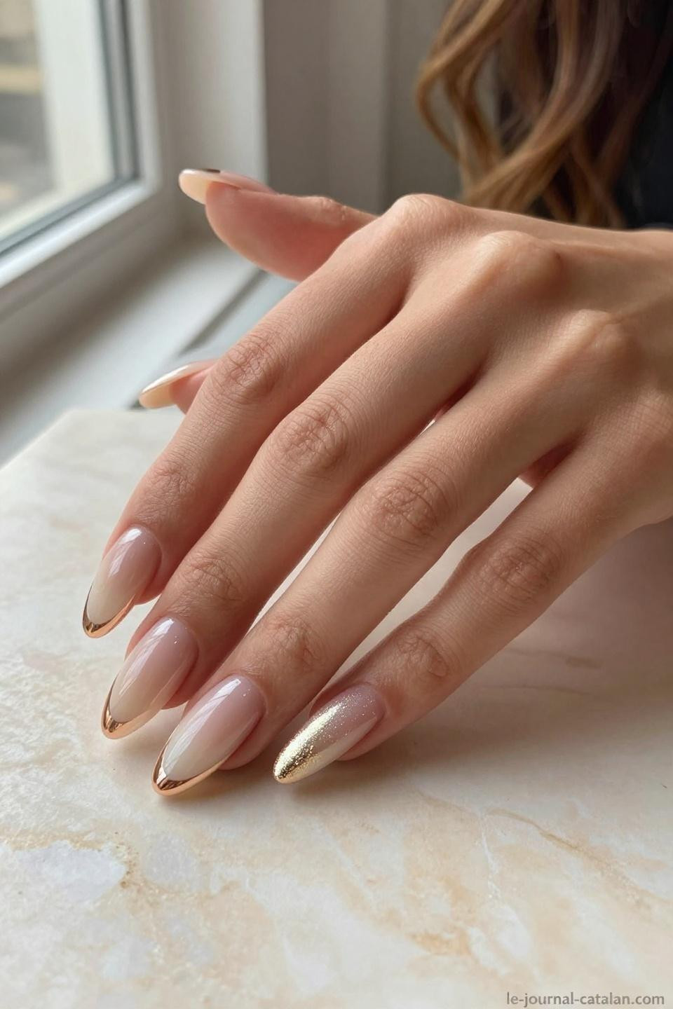 Pretty Almond Nails Classy nude to champagne shimmer ombre with rose gold accents on warm caramel skin