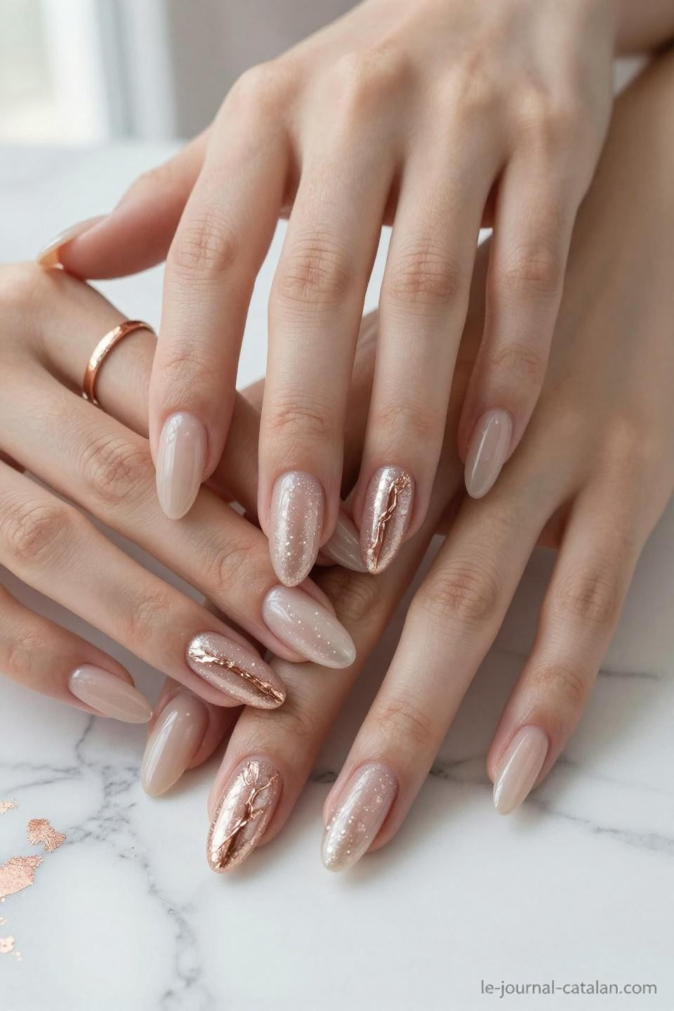 Pretty Almond Nails Classy nude with champagne shimmer and pearl white tips on warm golden hands