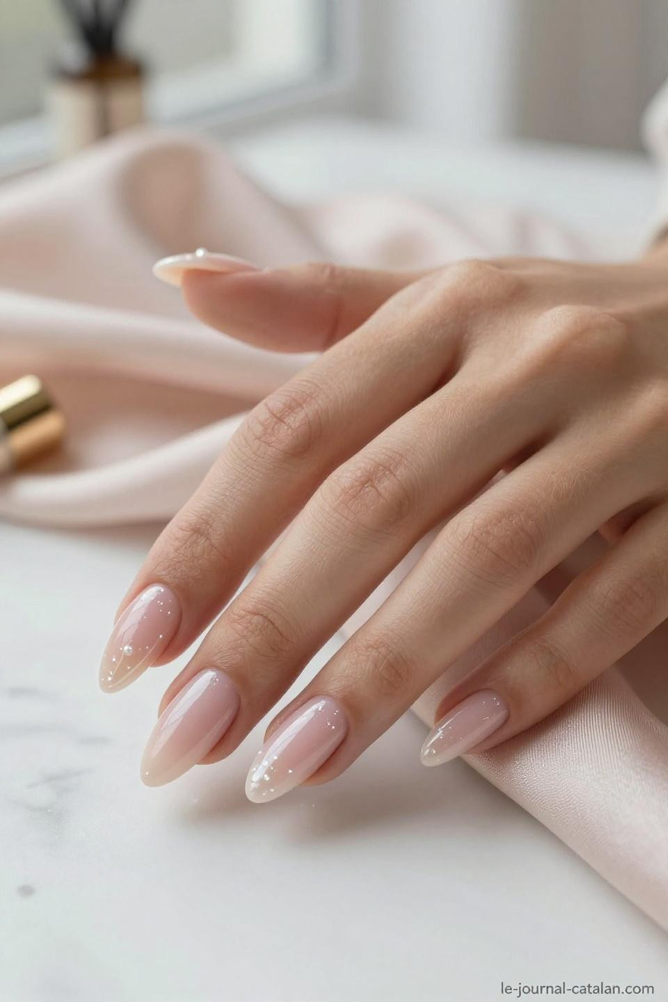 Pretty Almond Nails Classy nude pink with champagne shimmer on warm honey skin