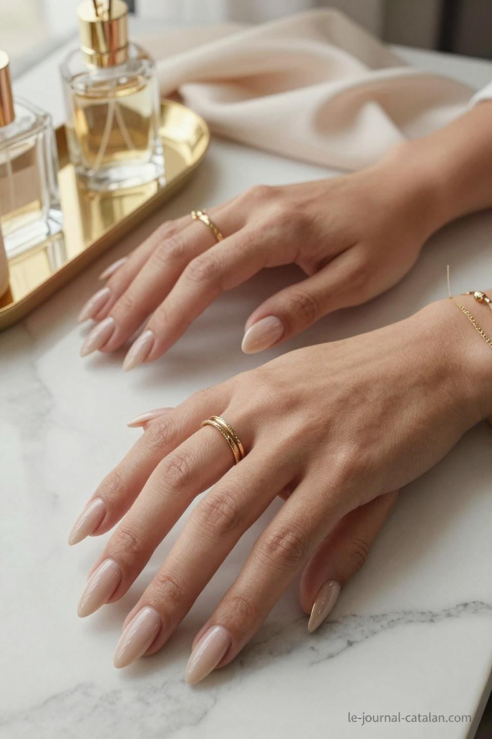 Pretty Almond Nails Classy soft beige nude on warm golden olive hands