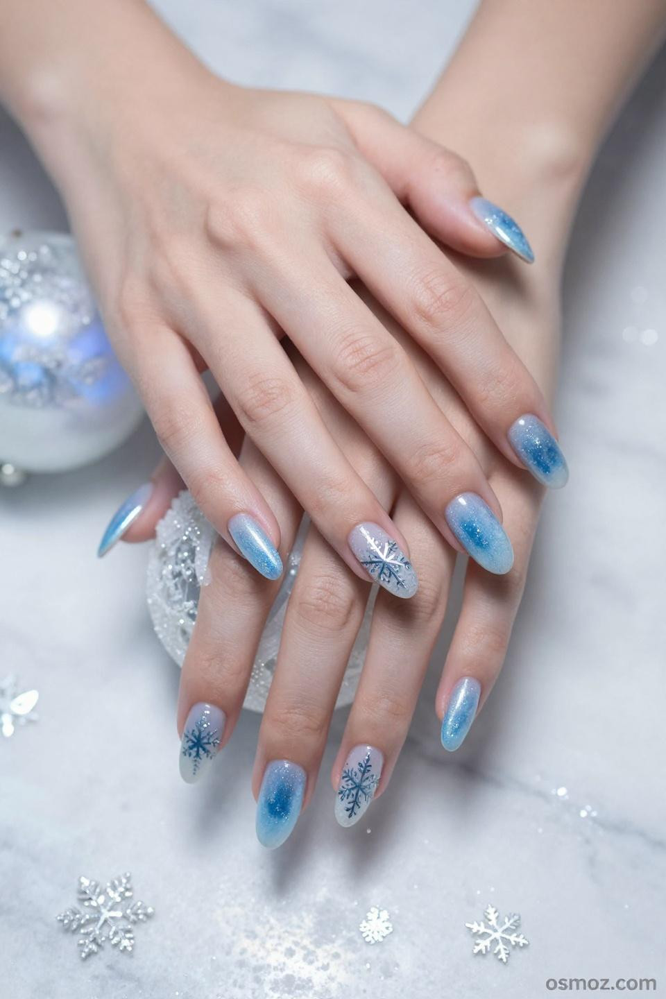 Icy Blue Nails Winter almond shaped gel manicure with snowflake details