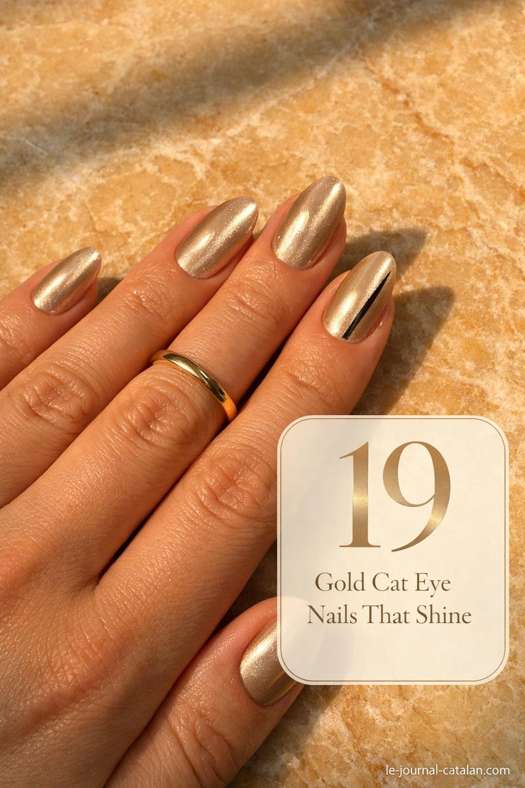 Gold cat eye gel polish nails with sleek magnetic finish and elegant curved stripe detail for a modern manicure look