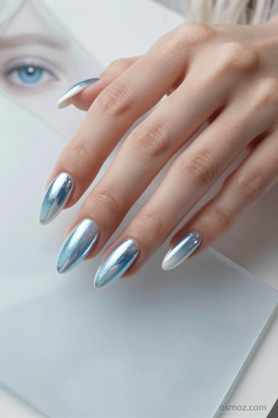 blue chrome acrylic nails with almond shape and mirror coating