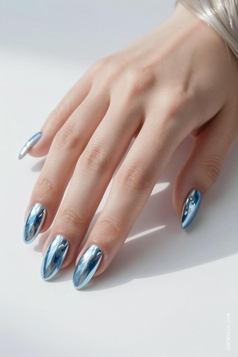 pale blue chrome nails with subtle mirror finish