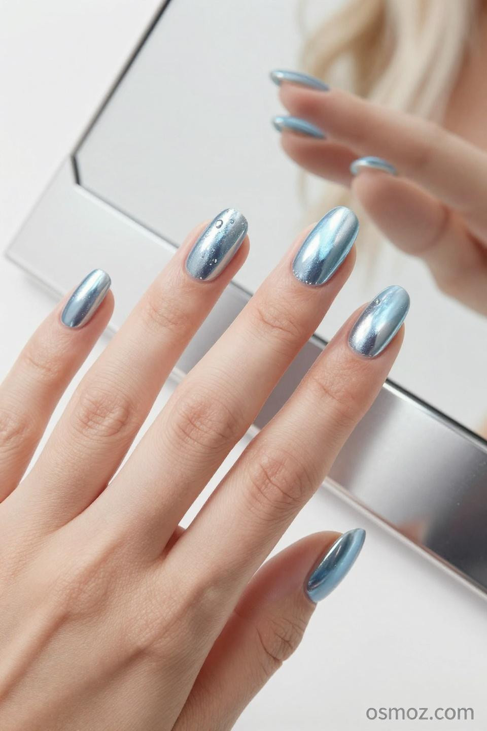 pale blue chrome nails with delicate mirror finish