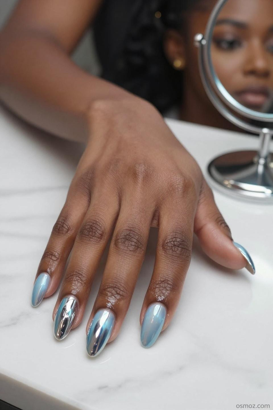 sky blue chrome nails with light reflective finish