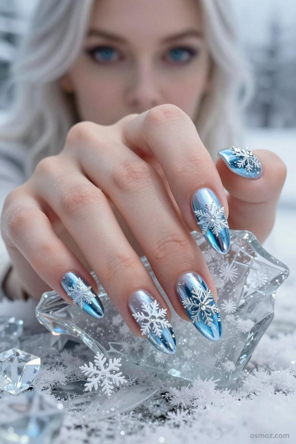 Blue Winter Nail Ideas showcasing creative artistry with unique frost patterns and embellishments