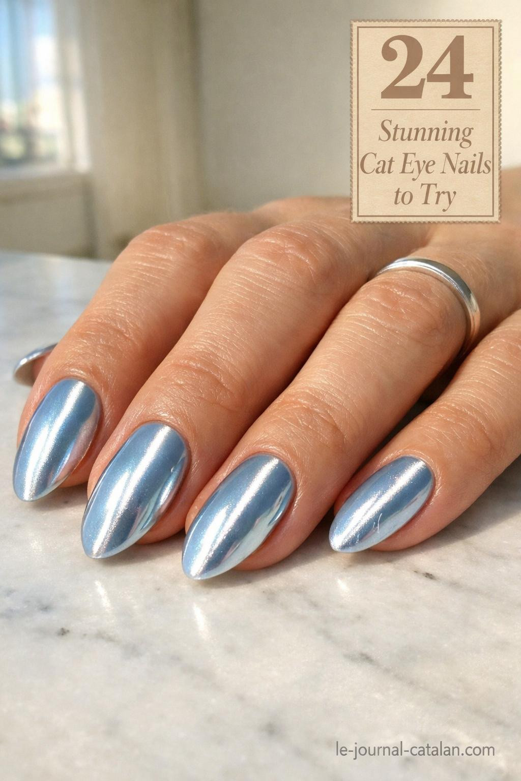 Cute cat eye nails in light blue shade with magnetic polish effect and sleek vertical stripe pattern for a modern nail look