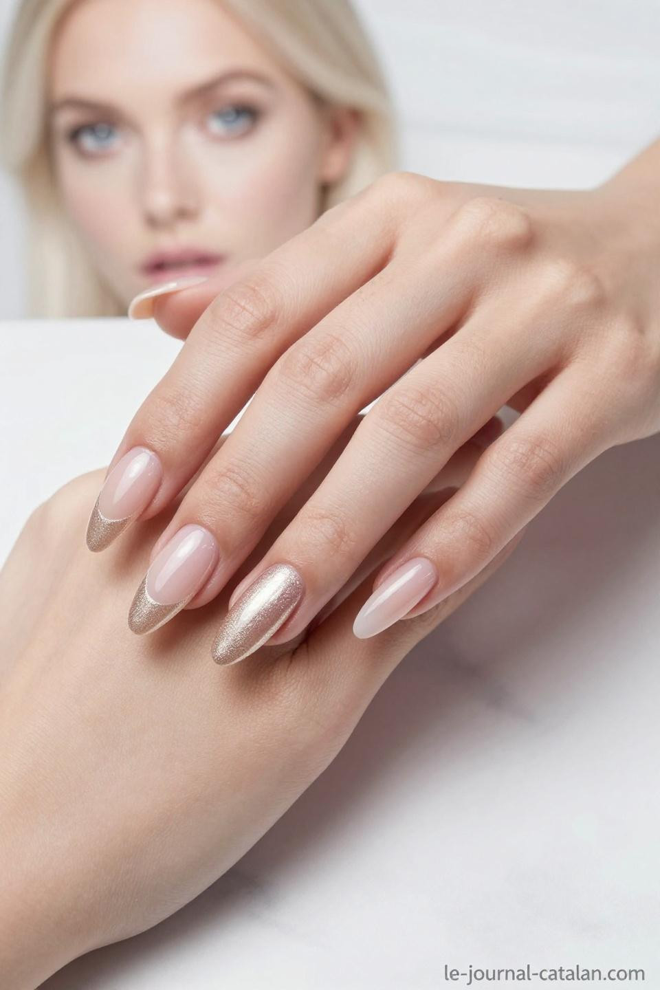 Extended Almond Nails featuring nude rose base with champagne shimmer overlay