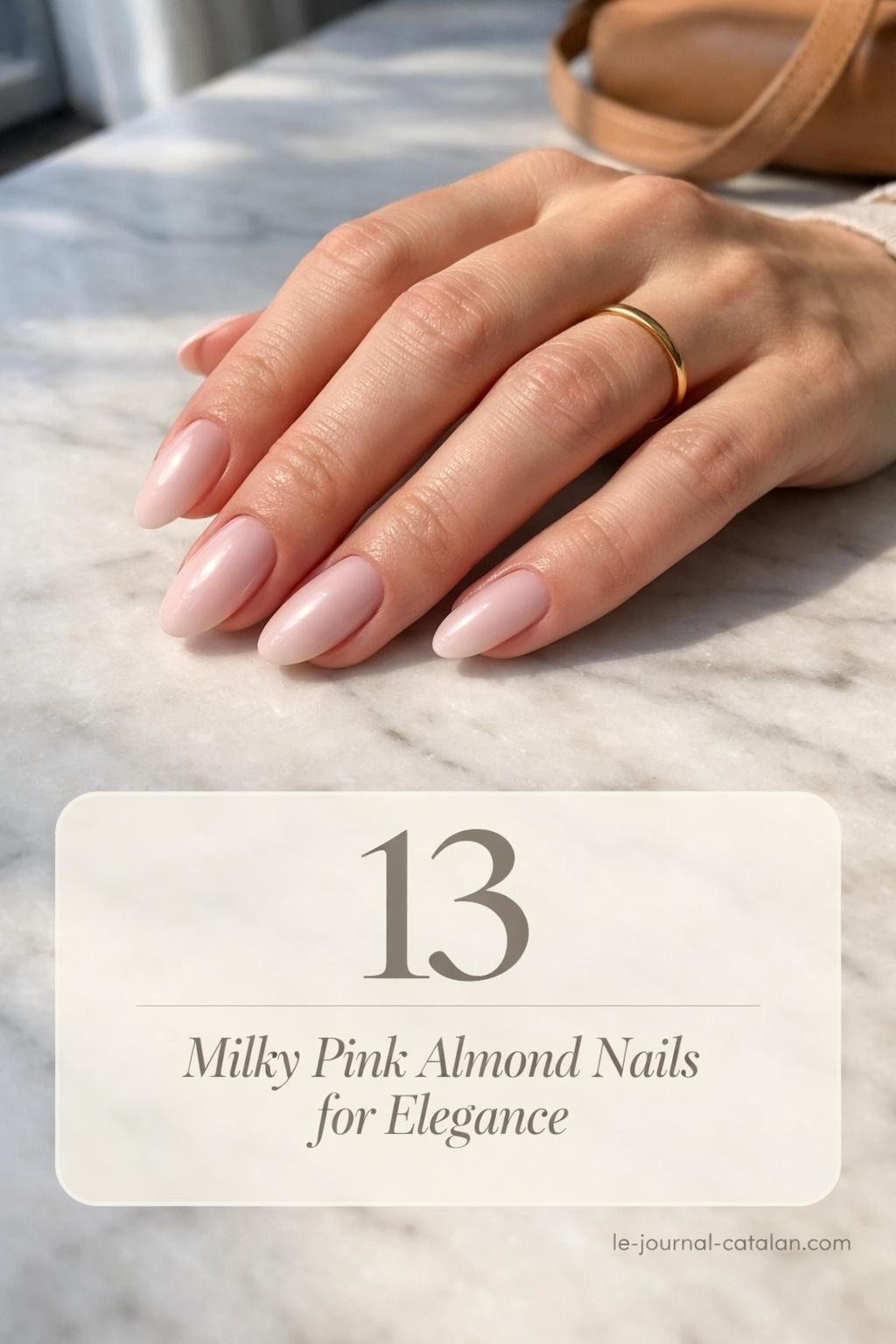Almond-shaped nude pink nails with milky finish and subtle design details, showcasing a classy and elegant nail style for everyday wear