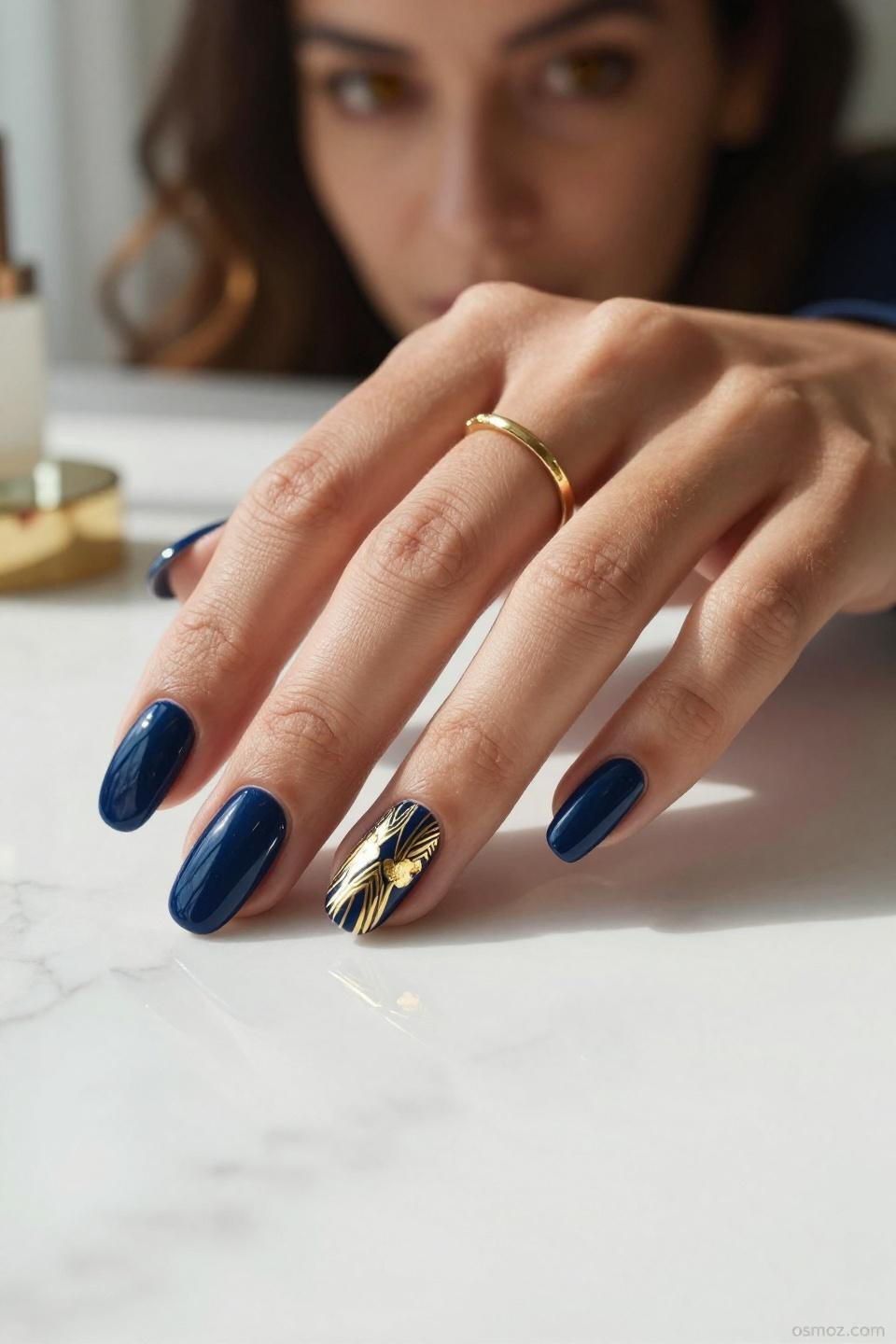Blue Nails Ideas showcasing navy gel with Art Deco gold patterns on almond nails