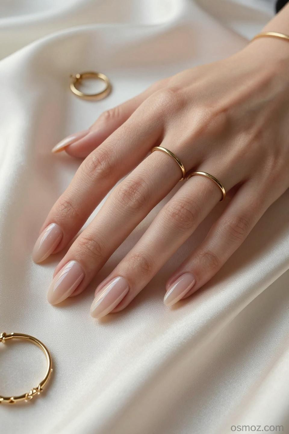 Nude Almond Nails with champagne shimmer