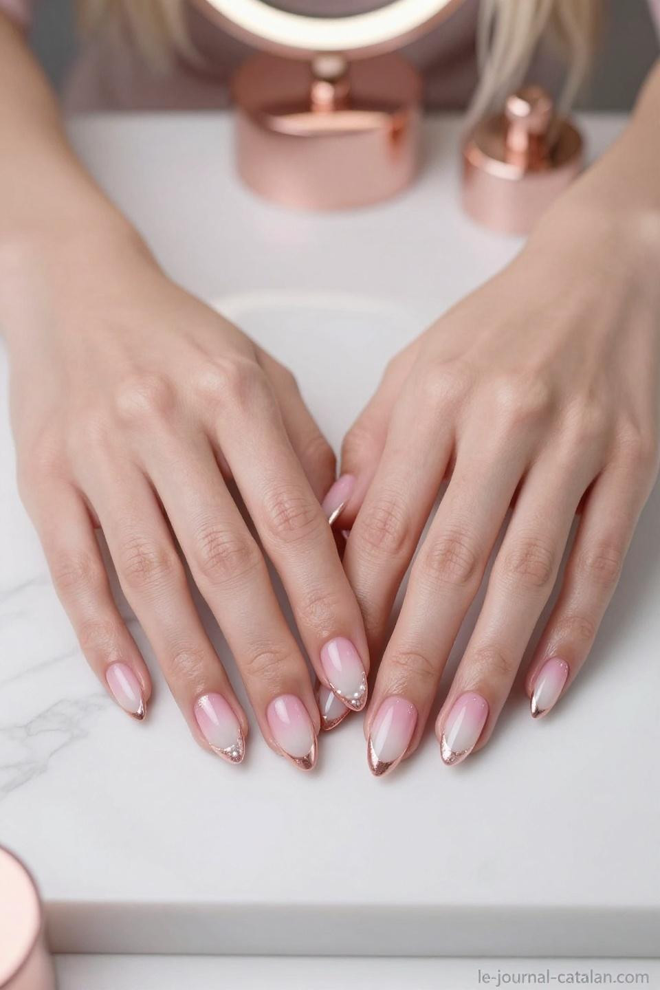 Almond French tip nails with pink base and chrome accent details