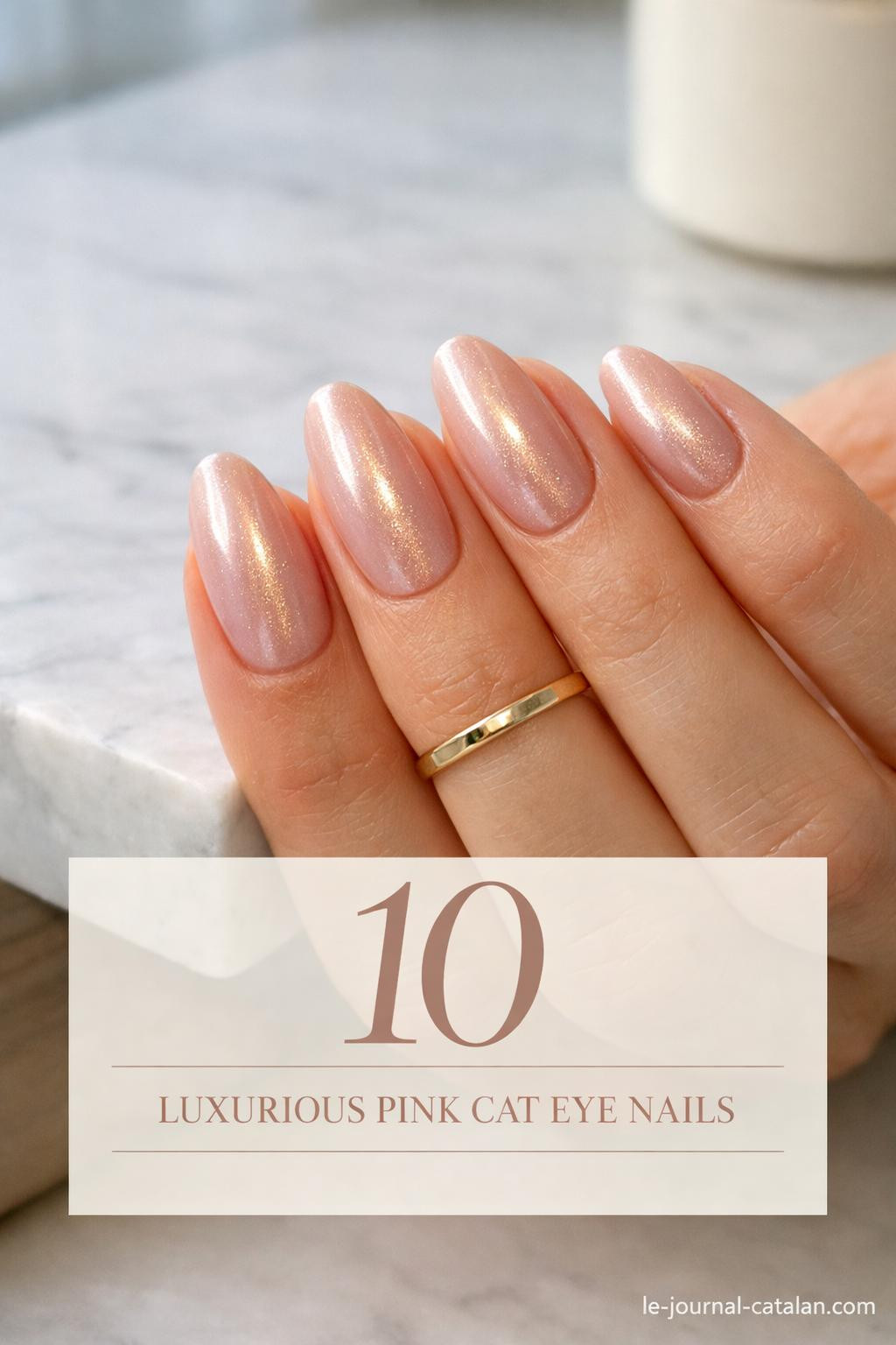 Pink cateye nail design featuring elegant glitter accents and glossy finish for a sophisticated manicure look