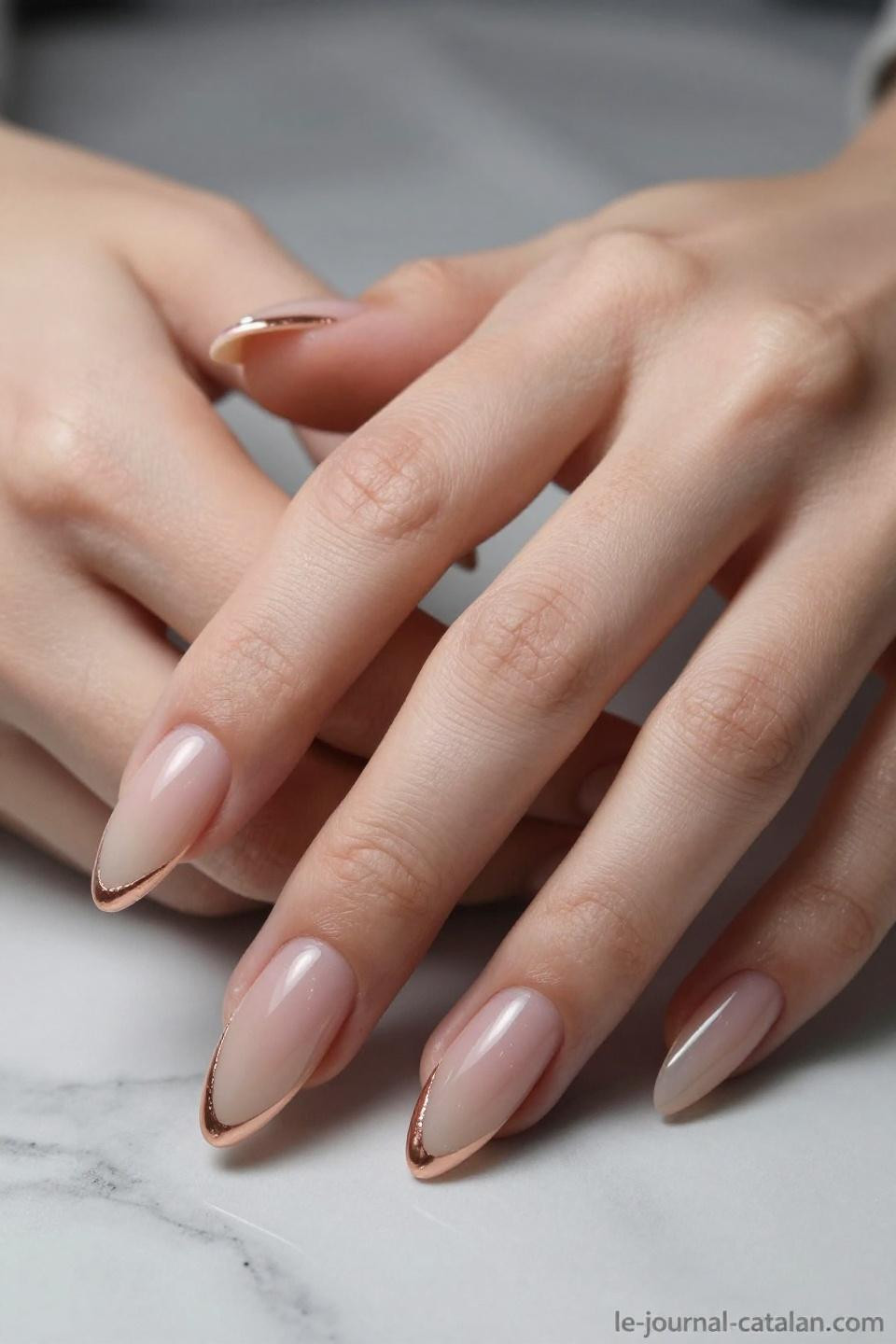 Elegant Almond Nails featuring pearl shimmer and rose gold metallic details