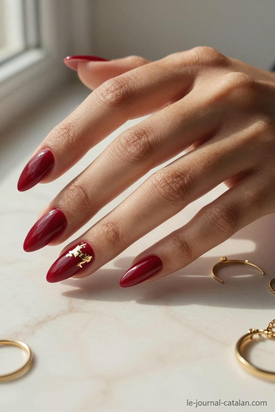 Red Almond Nails minimalist gold accent elegant cherry red manicure