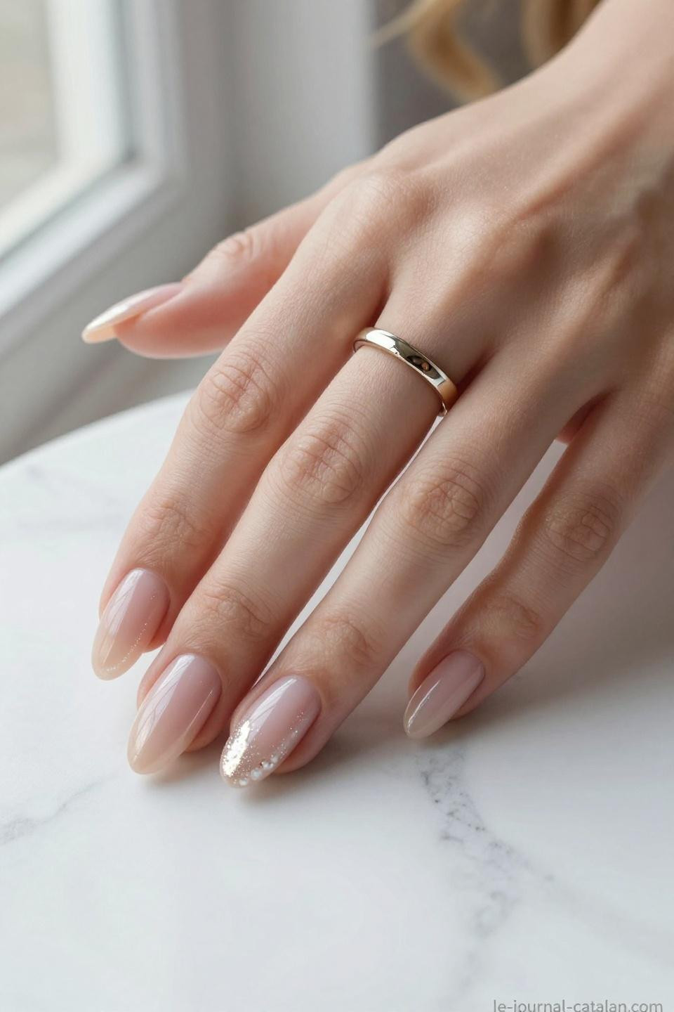 Short almond nails with nude rose base and pearl chrome shimmer accent nails