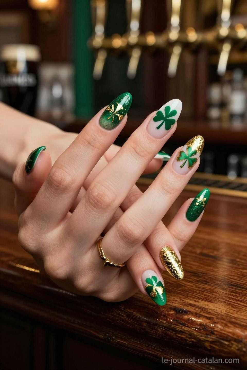 San Patrick Nails almond acrylics with embossed shamrocks and gold chrome finish
