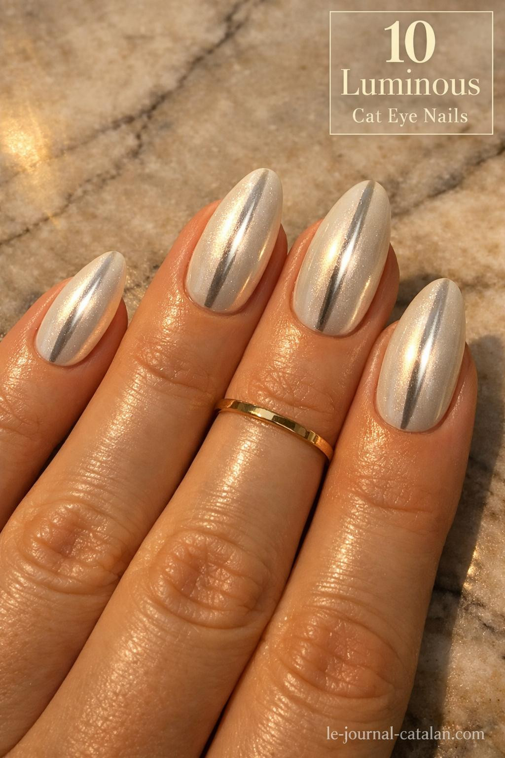 Light cat eye nails with magnetic polish effect creating a glowing linear stripe across white nail base for modern nail art inspiration